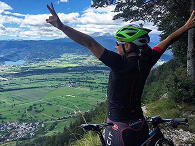 victorious mountain biker at lake Bled