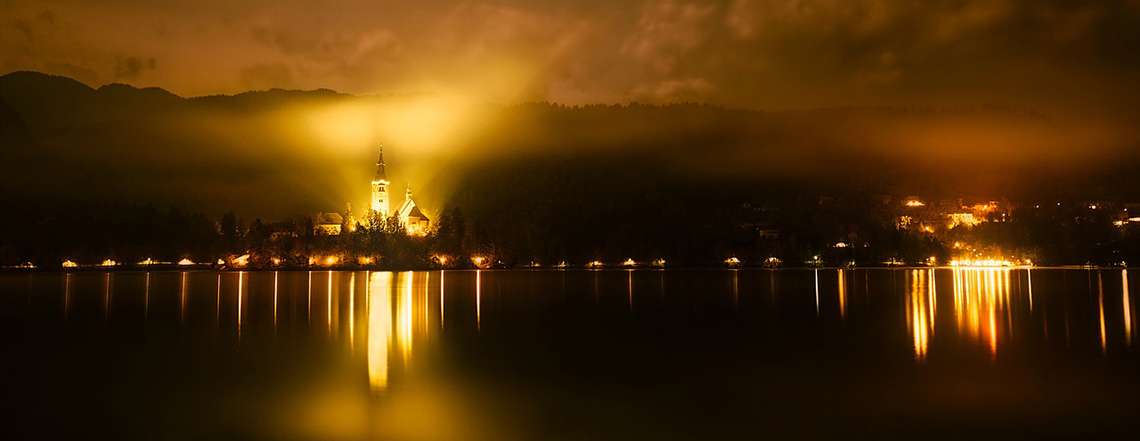 island of lake Bled at night cycling in Slovenia